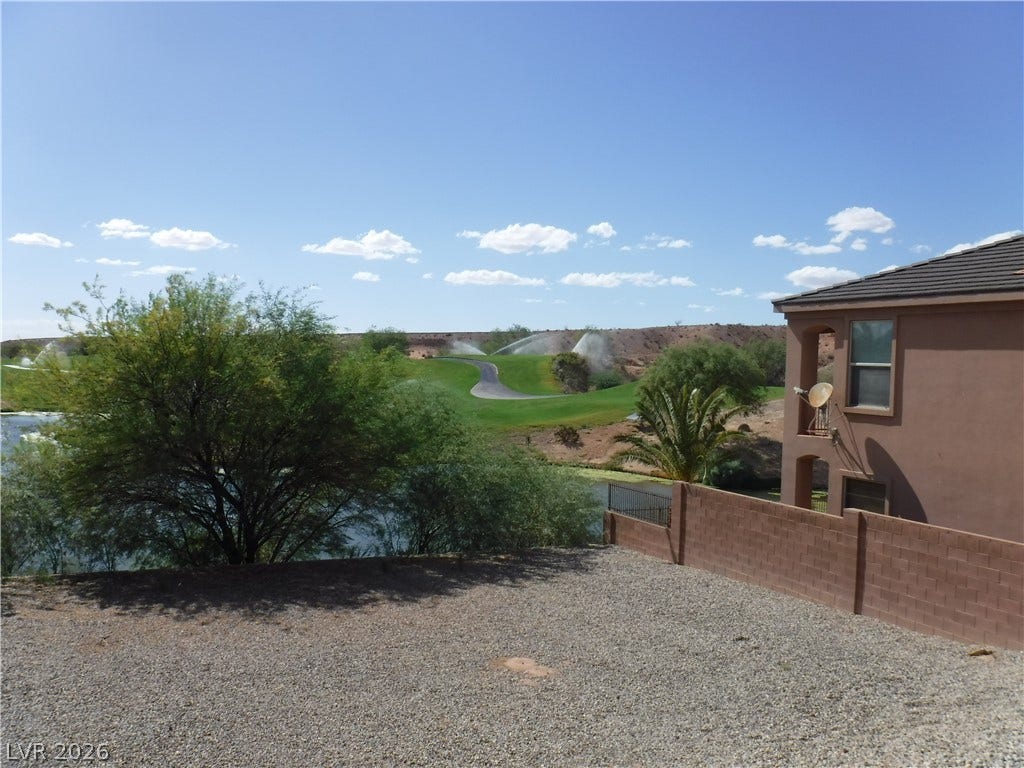 654 Paloma Circle, Mesquite, NV 89027 Scenic golf course views stretch beyond the property border under a bright sky.