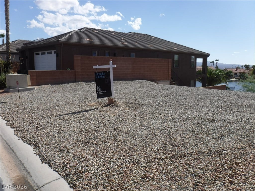 654 Paloma Circle, Mesquite, NV 89027 Low maintenance desert landscaping complements this two story stucco home with a tiled roof.