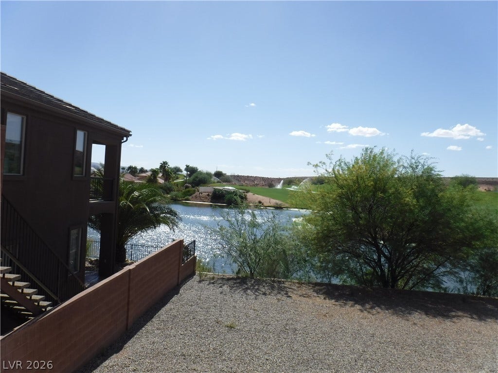 654 Paloma Circle, Mesquite, NV 89027 Quiet lake and golf course views frame the rear exterior of this multi-level home.