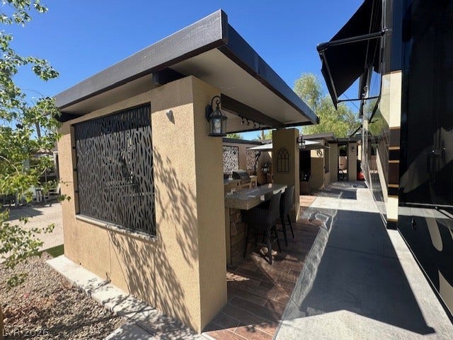 8175 Arville Street, #133, Las Vegas, NV 89139 An inviting outdoor bar area highlights this well-appointed exterior space.