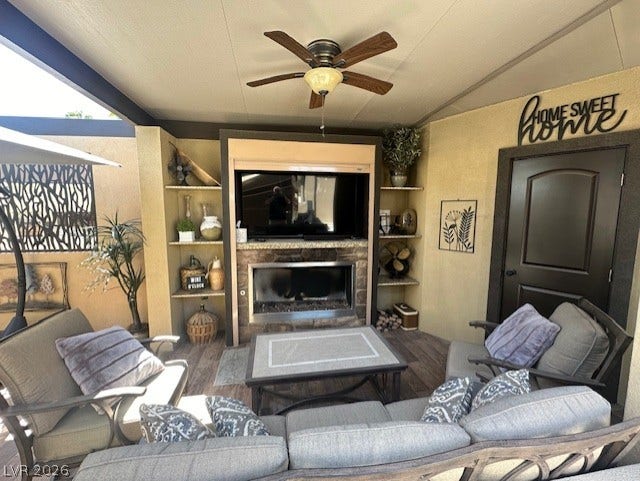 8175 Arville Street, #133, Las Vegas, NV 89139 An inviting covered patio highlights a stone-surrounded fireplace and tile flooring.