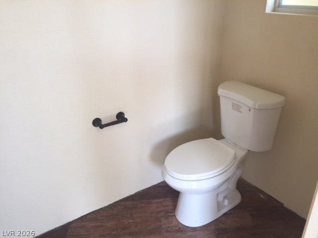 8175 Arville Street, #133, Las Vegas, NV 89139 A classic toilet alcove highlights durable wood-look flooring and clean neutral walls.