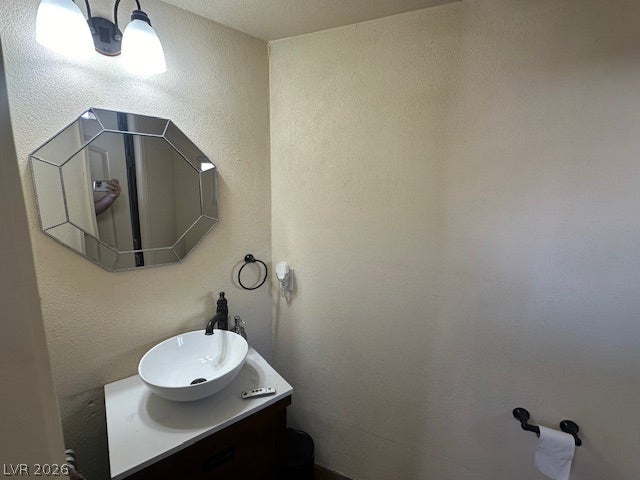 8175 Arville Street, #133, Las Vegas, NV 89139 An elegant vessel sink sits atop a compact vanity in this updated powder room.