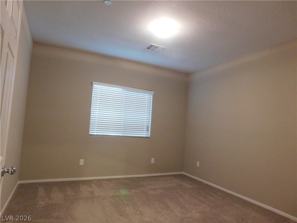 2715 Amazing Meadows Avenue, #1185, North Las Vegas, NV 89031 Soft carpeting underfoot defines this comfortable room complete with a wide, bright window.