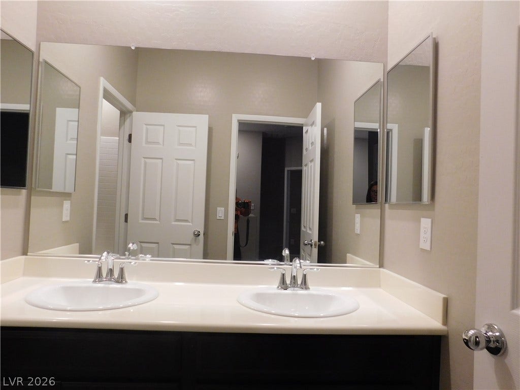 2715 Amazing Meadows Avenue, #1185, North Las Vegas, NV 89031 Dual basins set in a long vanity create a highly functional morning routine space.