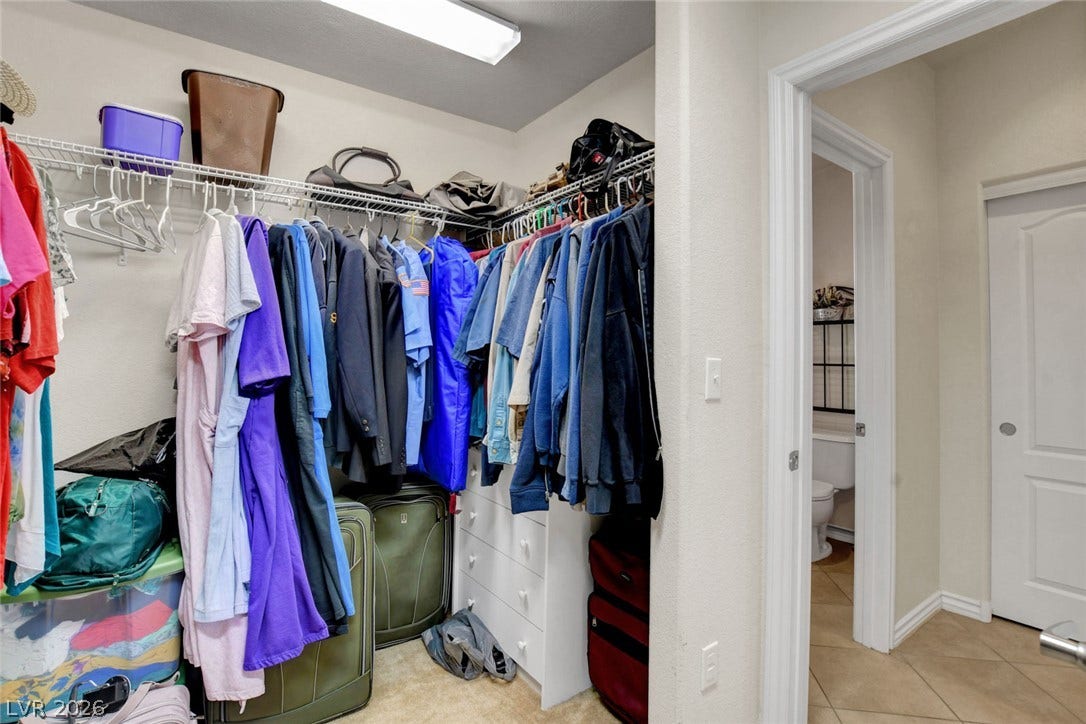 5508 Meridian Rain Street, North Las Vegas, NV 89031 Ample wire shelving and storage options maximize organization within this functional walk-in closet space.