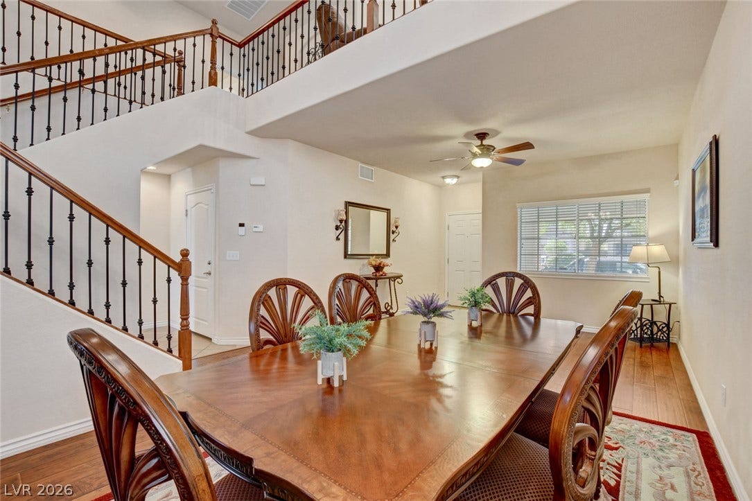 5508 Meridian Rain Street, North Las Vegas, NV 89031 Gleaming hardwood floors and a soaring staircase define this open dining space.