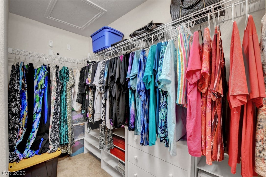5508 Meridian Rain Street, North Las Vegas, NV 89031 Ample wire shelving and built-in drawers maximize storage in this carpeted closet.