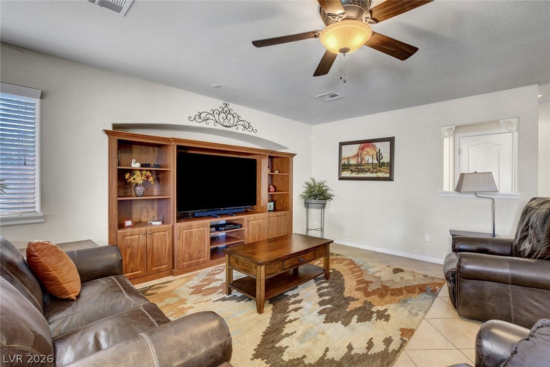 5508 Meridian Rain Street, North Las Vegas, NV 89031 Tiled flooring and a recessed alcove accent this comfortable central living space.