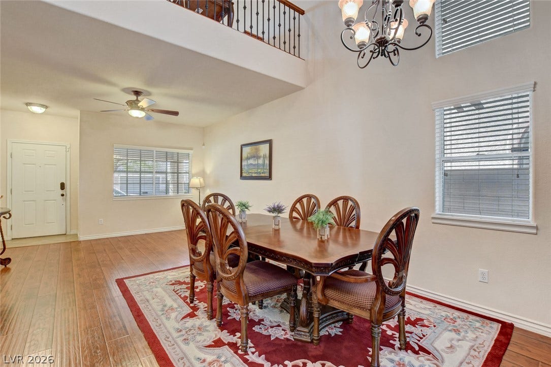 5508 Meridian Rain Street, North Las Vegas, NV 89031 Soaring ceilings and rich wood-look flooring enhance this inviting dining space.