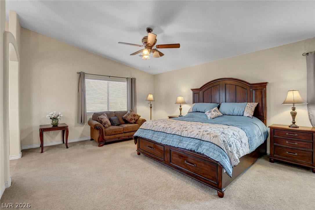5508 Meridian Rain Street, North Las Vegas, NV 89031 Vaulted ceilings and broad windows enhance this relaxing bedroom suite.