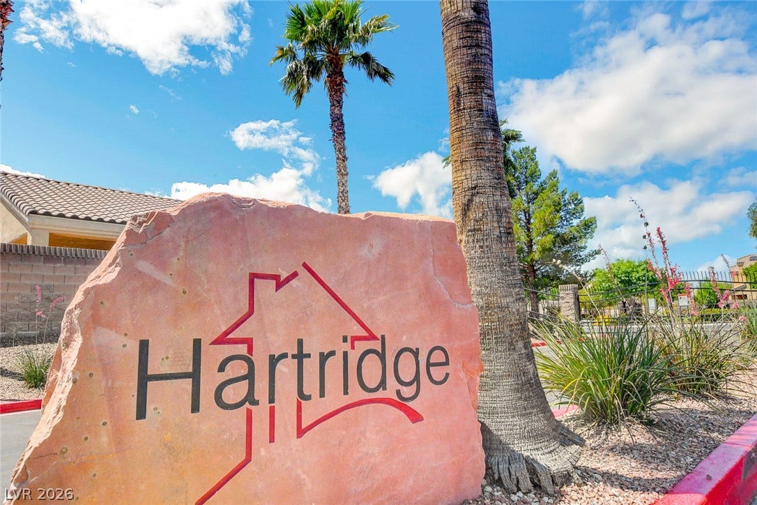 5508 Meridian Rain Street, North Las Vegas, NV 89031 Welcoming community signage stands amid desert landscaping and palm trees under blue skies.