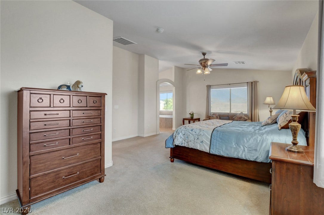 5508 Meridian Rain Street, North Las Vegas, NV 89031 High ceilings and wall-to-wall carpeting define this expansive, relaxing main level bedroom suite.