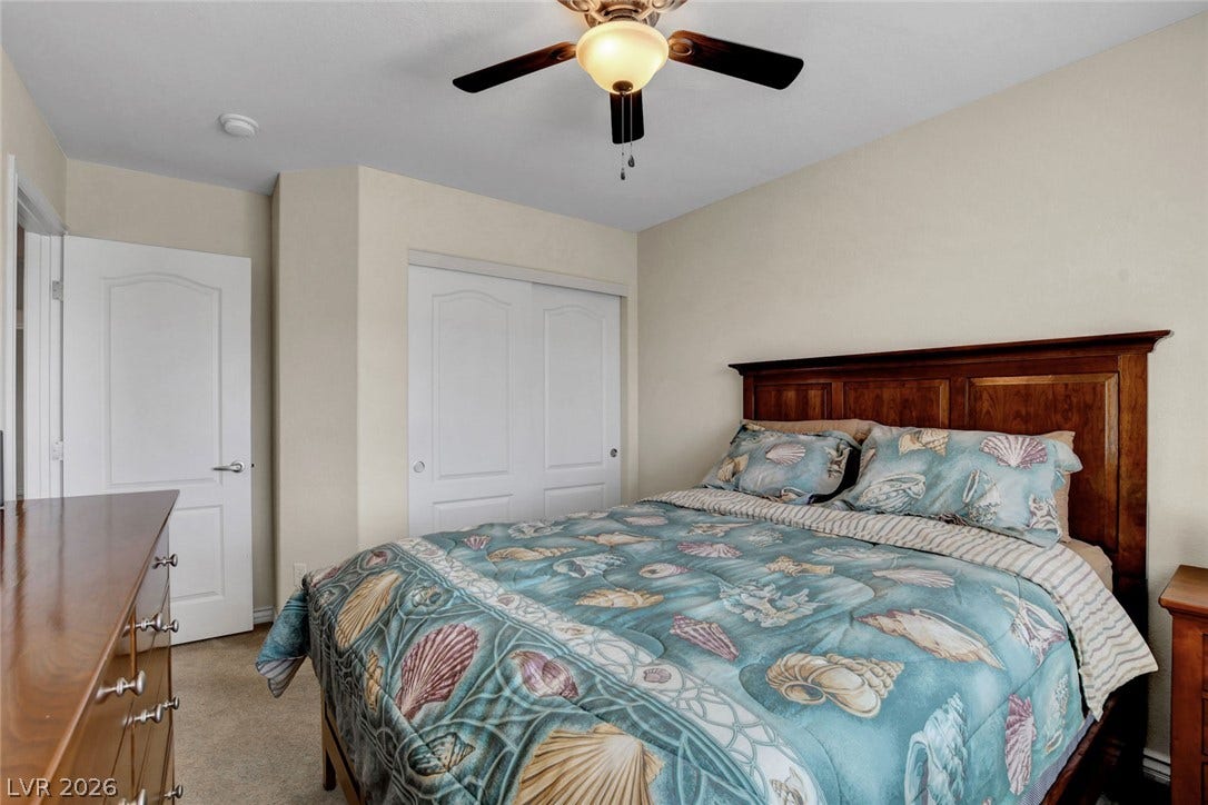 5508 Meridian Rain Street, North Las Vegas, NV 89031 Soft carpeting underfoot provides cozy warmth throughout this inviting bedroom space.