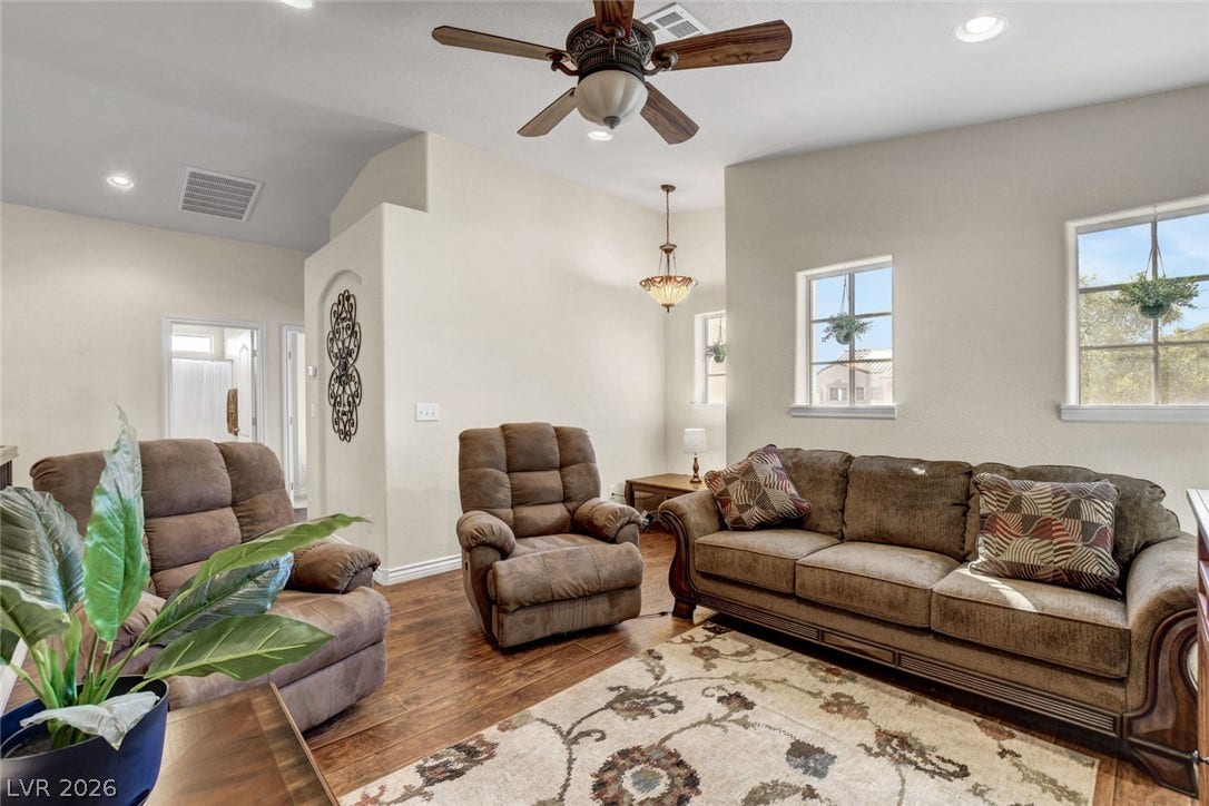 5508 Meridian Rain Street, North Las Vegas, NV 89031 Gleaming wood-look floors pair beautifully with high ceilings and recessed lighting in this comfortable space.