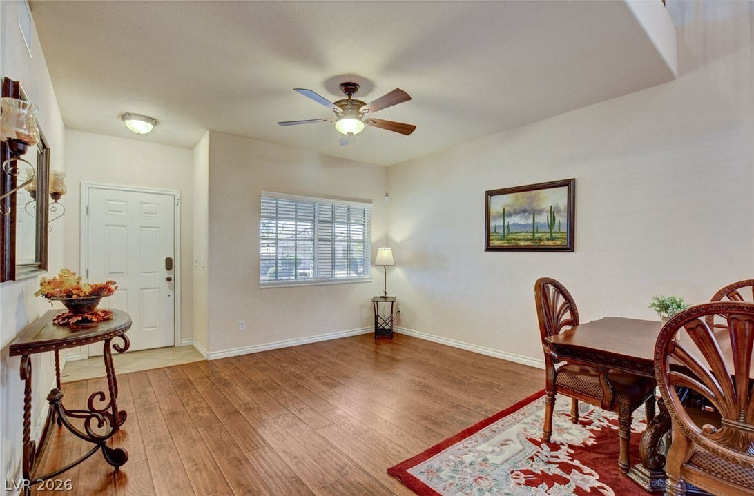 5508 Meridian Rain Street, North Las Vegas, NV 89031 Warm wood-look flooring and an abundance of natural light welcome visitors into this versatile living space.