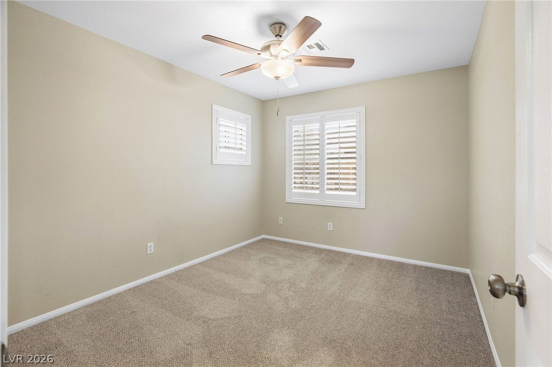 2381 Predera Avenue, Henderson, NV 89052 Plush carpeting and plantation shutters define this versatile secondary bedroom.