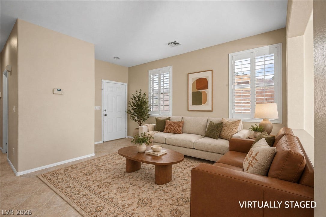 2381 Predera Avenue, Henderson, NV 89052 High ceilings and plantation shutters bring character to this airy living space.