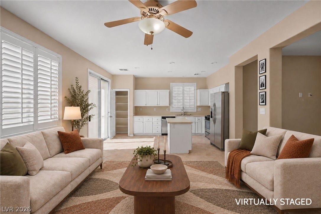 2381 Predera Avenue, Henderson, NV 89052 An open-concept living area flows into the kitchen under smooth plaster ceilings.