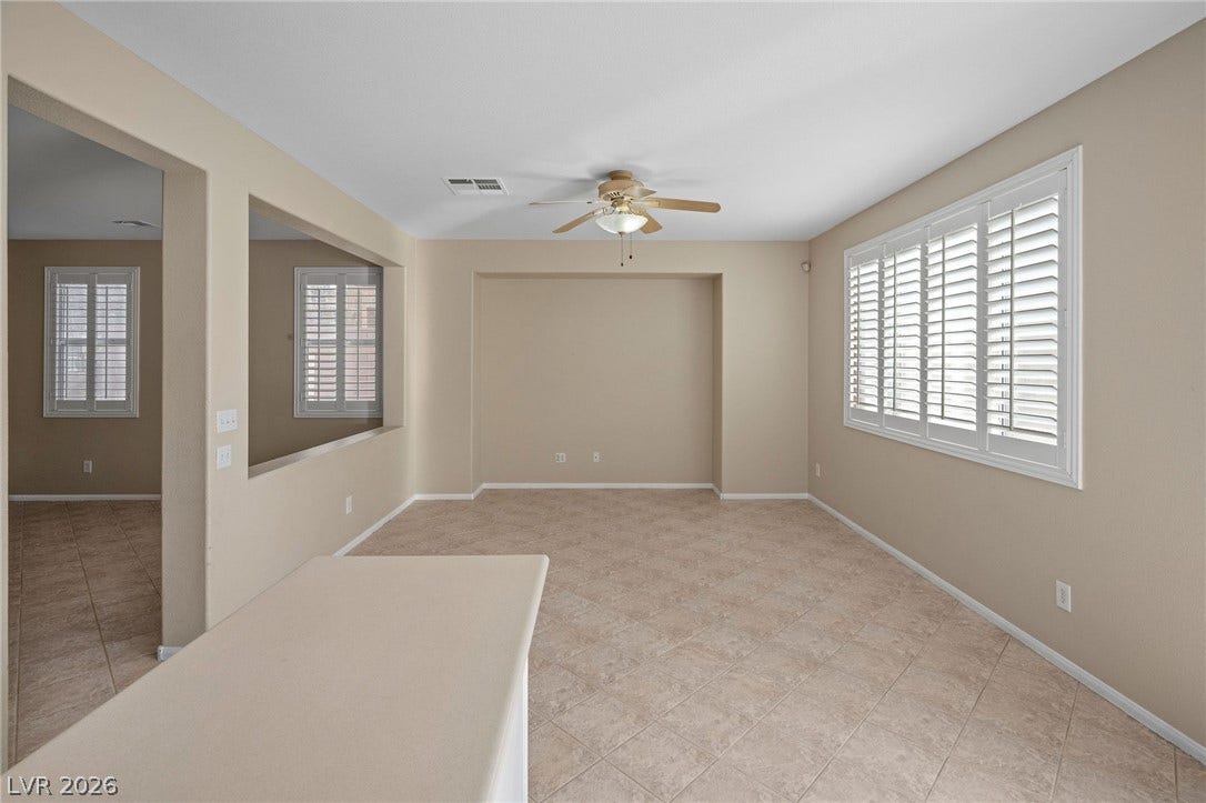 2381 Predera Avenue, Henderson, NV 89052 An open floor plan with tile flooring and plantation shutters creates a versatile living space.