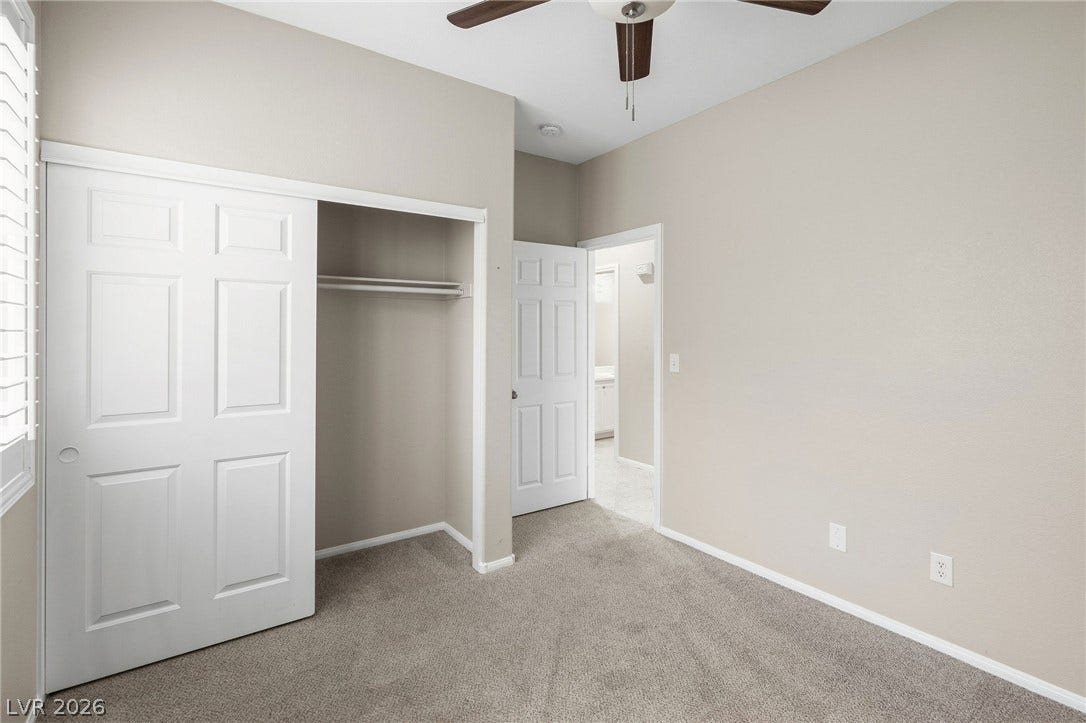 2381 Predera Avenue, Henderson, NV 89052 High ceilings and neutral plush carpeting define this versatile secondary bedroom space.