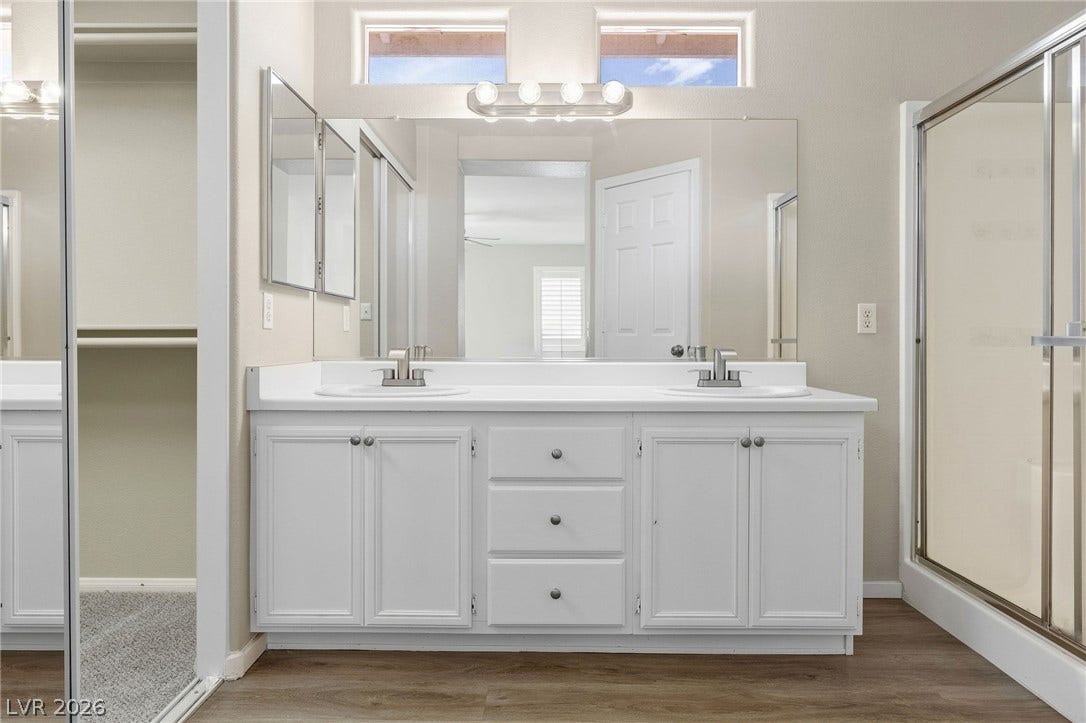 2381 Predera Avenue, Henderson, NV 89052 High clerestory windows bring natural light into this bathroom featuring a spacious double vanity.
