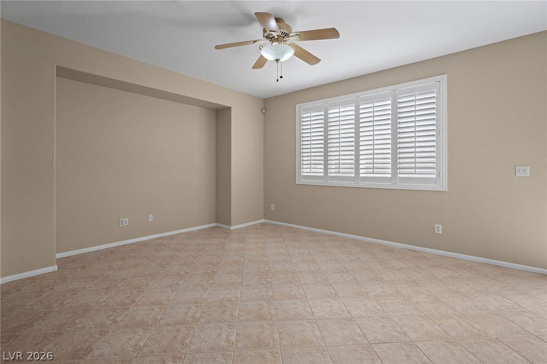 2381 Predera Avenue, Henderson, NV 89052 Tiled flooring and clean lines define this versatile space illuminated by a wide shuttered window.