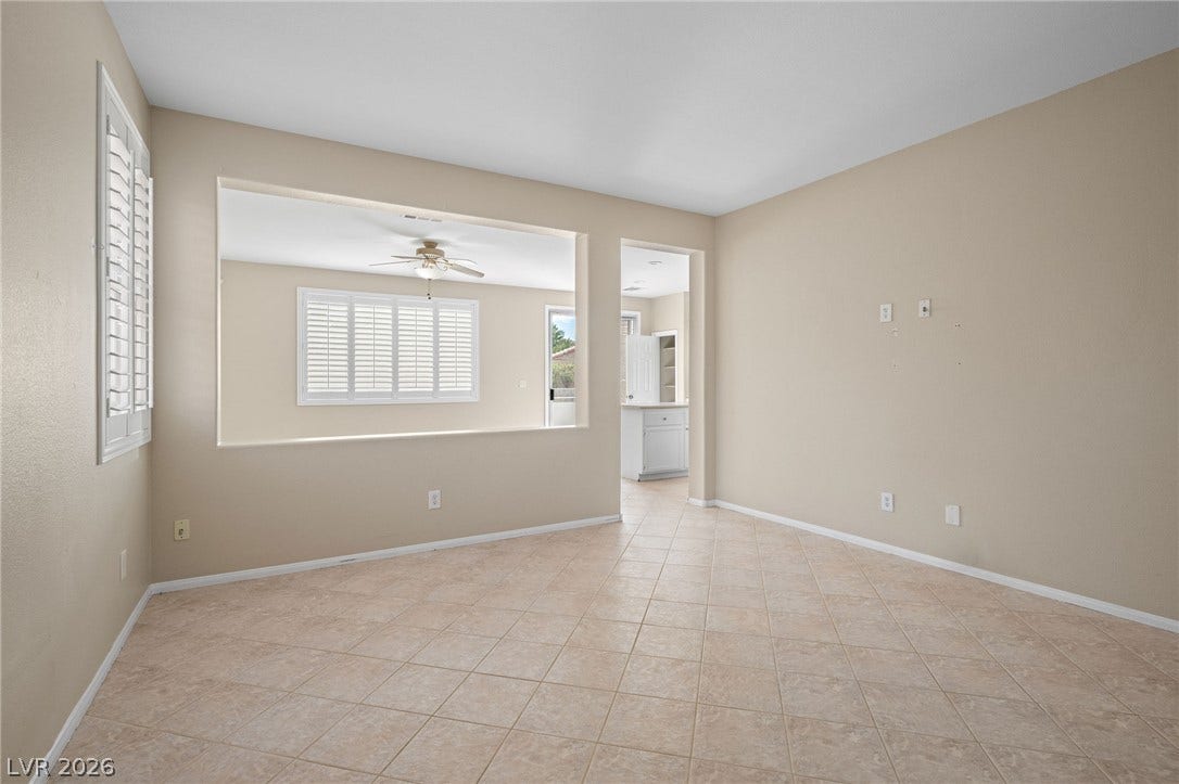 2381 Predera Avenue, Henderson, NV 89052 An open pass-through window connects this tiled living space directly to the kitchen area.