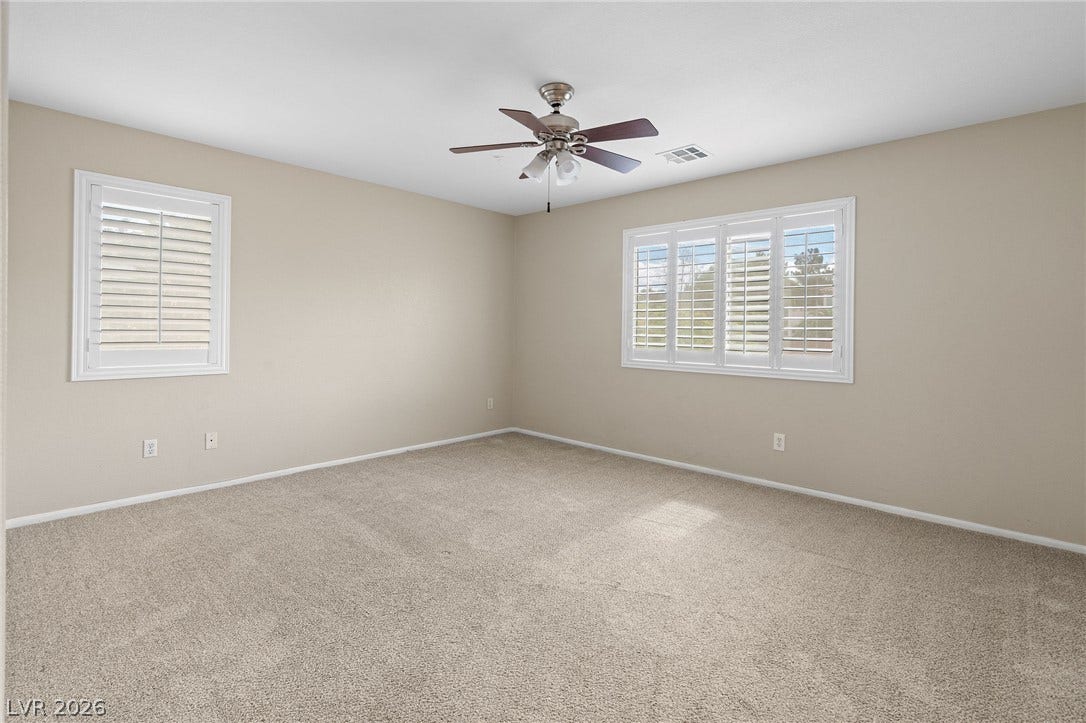 2381 Predera Avenue, Henderson, NV 89052 Plush carpeting and plantation shutters define this versatile secondary room.