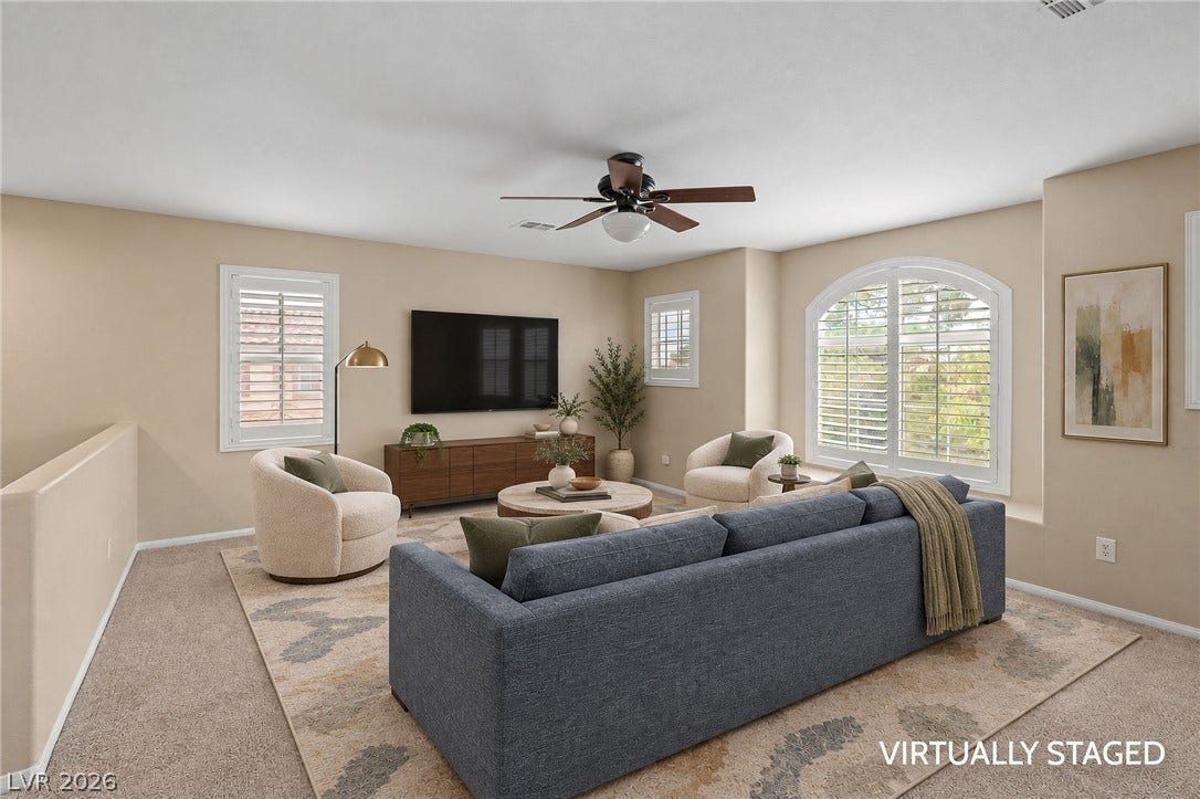 2381 Predera Avenue, Henderson, NV 89052 Arched windows and plush carpeting define this spacious upstairs living area.