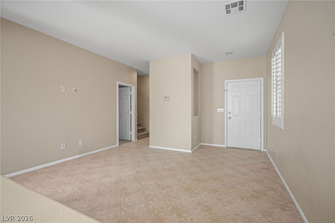 2381 Predera Avenue, Henderson, NV 89052 An inviting entrance foyer welcomes guests with durable tile flooring and natural light.