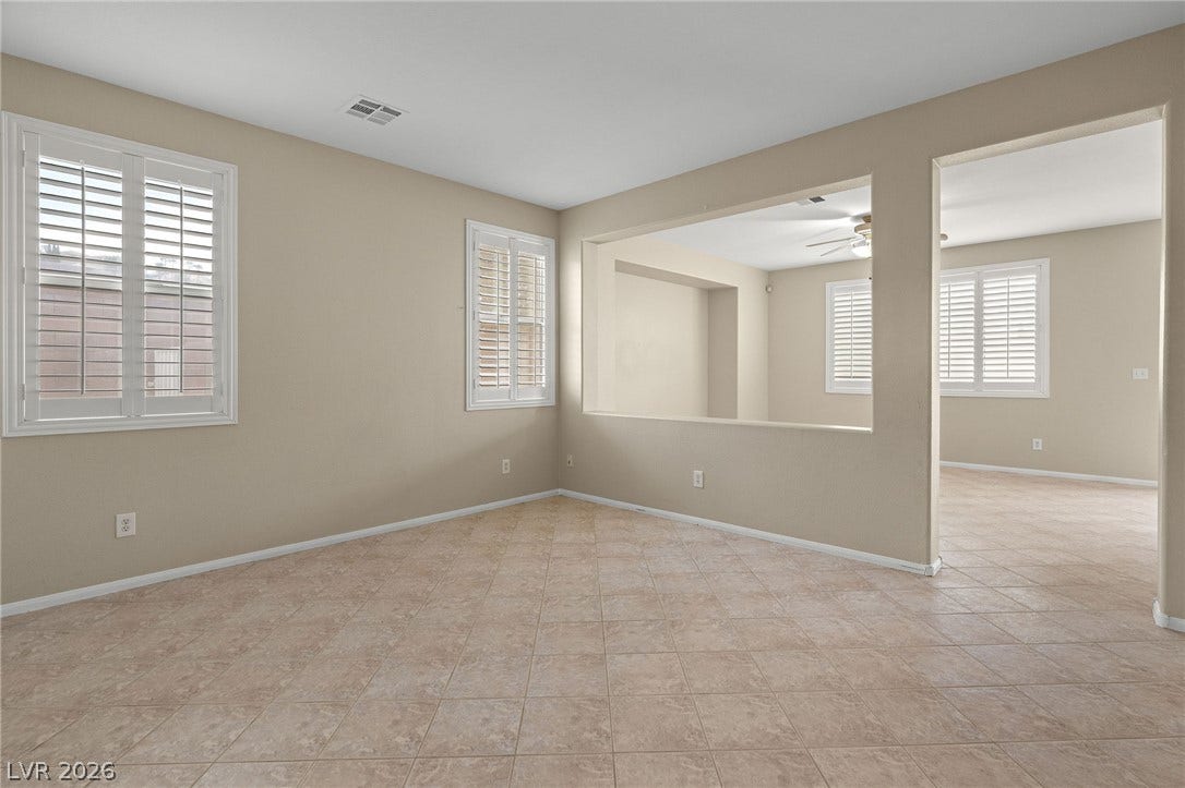2381 Predera Avenue, Henderson, NV 89052 Tiled flooring and plantation shutters define this versatile, open living area.
