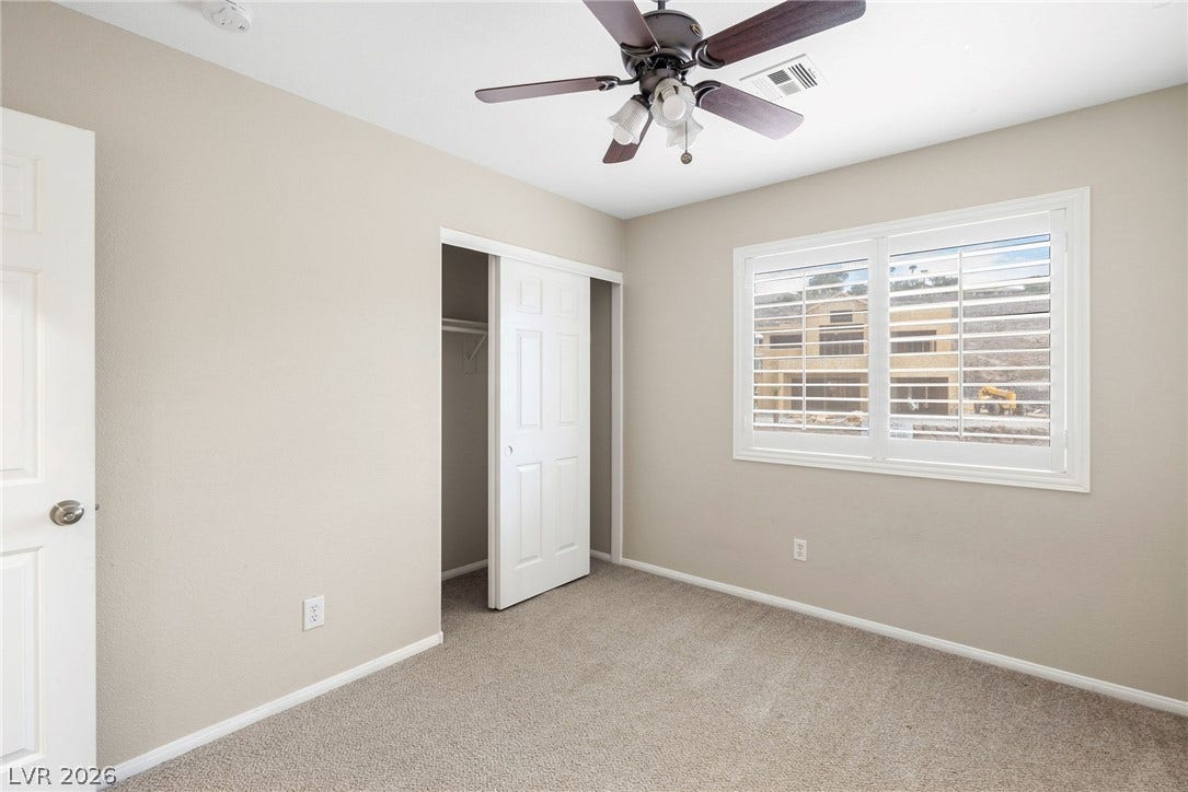 2381 Predera Avenue, Henderson, NV 89052 Plush carpeting and plantation shutters define this comfortable secondary bedroom.