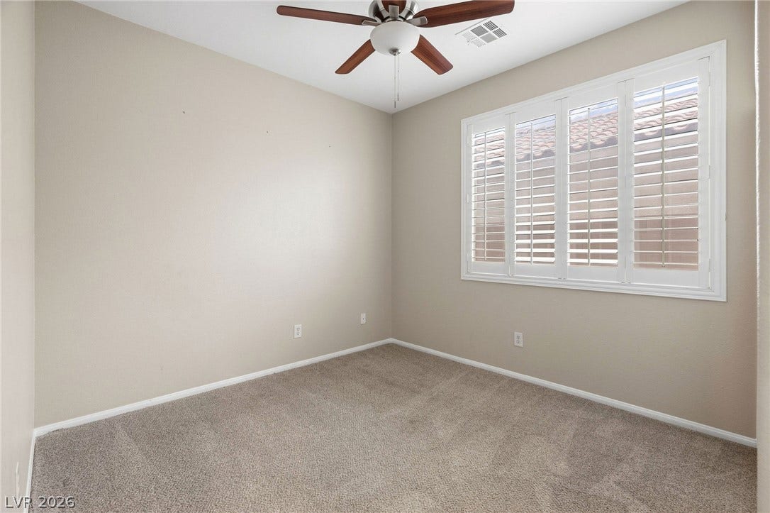 2381 Predera Avenue, Henderson, NV 89052 Plush carpeting and plantation shutters define this versatile secondary room.