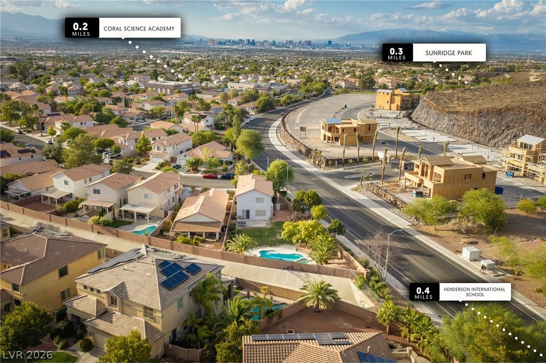 2381 Predera Avenue, Henderson, NV 89052 An aerial perspective showcases the surrounding neighborhood with nearby parks and schools.