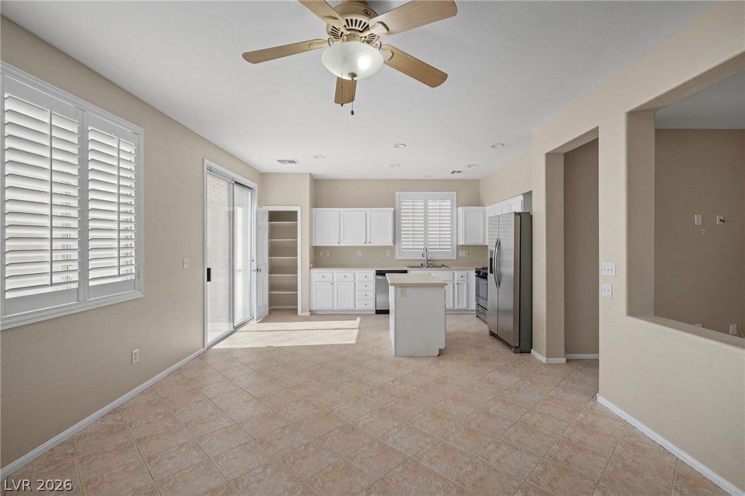 2381 Predera Avenue, Henderson, NV 89052 Tile flooring and an open layout connect the dining space directly to the kitchen area.