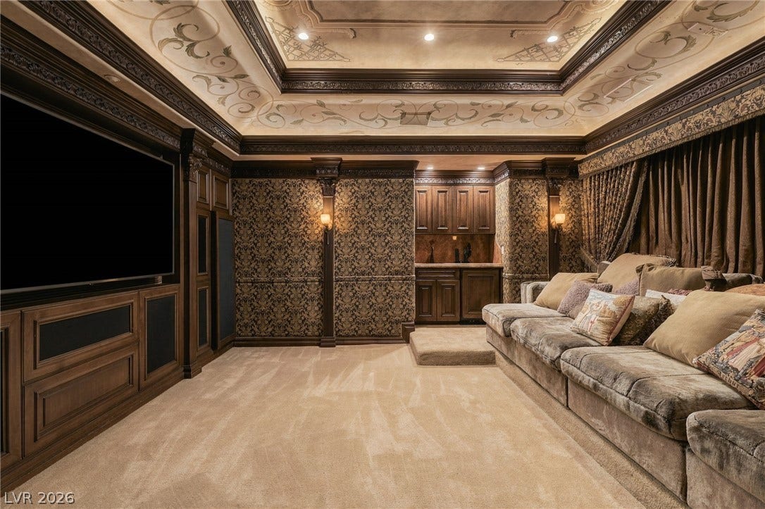 1513 Foothills Village Drive, Henderson, NV 89012 Ornate wood paneling and a custom painted tray ceiling elevate this private home theater.