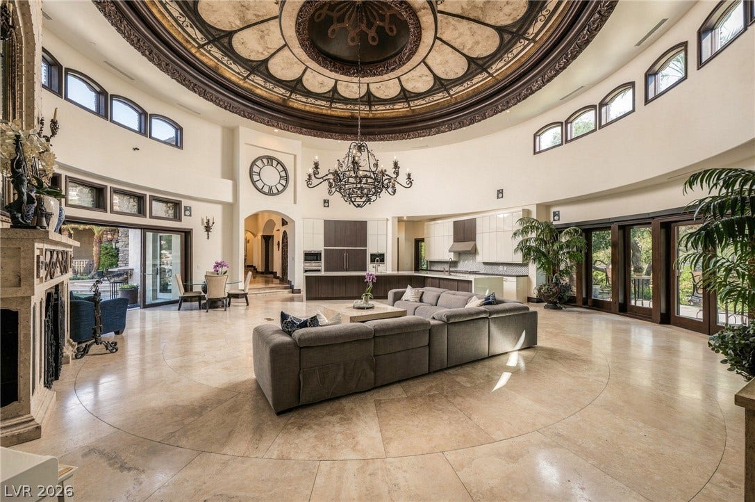 1513 Foothills Village Drive, Henderson, NV 89012 An extraordinary domed ceiling crowns this grand open living space finished with travertine flooring.
