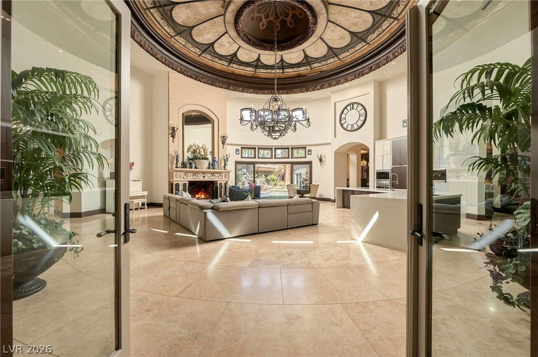 1513 Foothills Village Drive, Henderson, NV 89012 Gleaming stone flooring pairs with an ornate domed ceiling in this grand open living space.