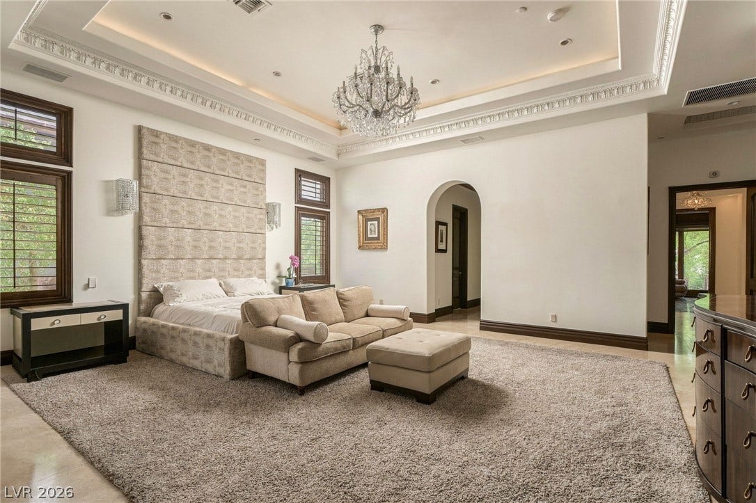 1513 Foothills Village Drive, Henderson, NV 89012 An elegant tray ceiling with intricate crown molding defines this grand bedroom suite.