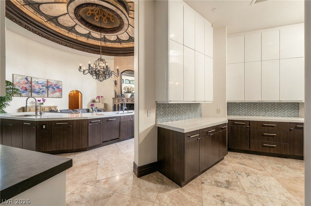 1513 Foothills Village Drive, Henderson, NV 89012 Ornate ceiling details and polished tile floors frame this modern prep kitchen area.