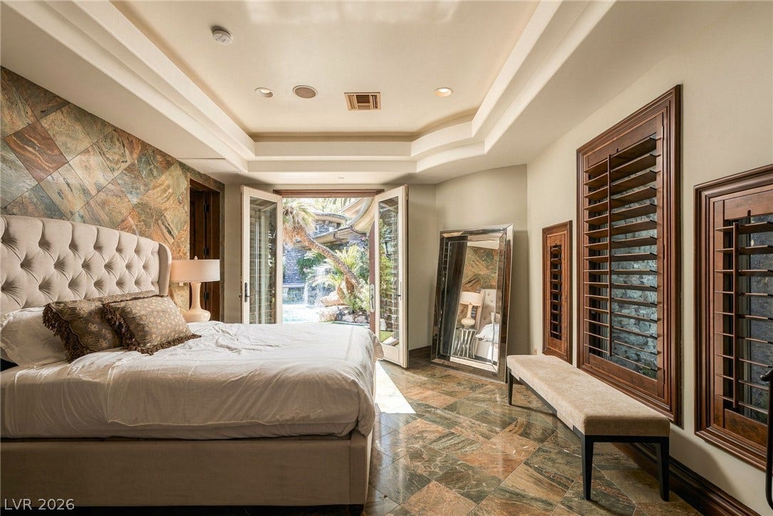 1513 Foothills Village Drive, Henderson, NV 89012 Double doors open from this bedroom to a lush private courtyard.