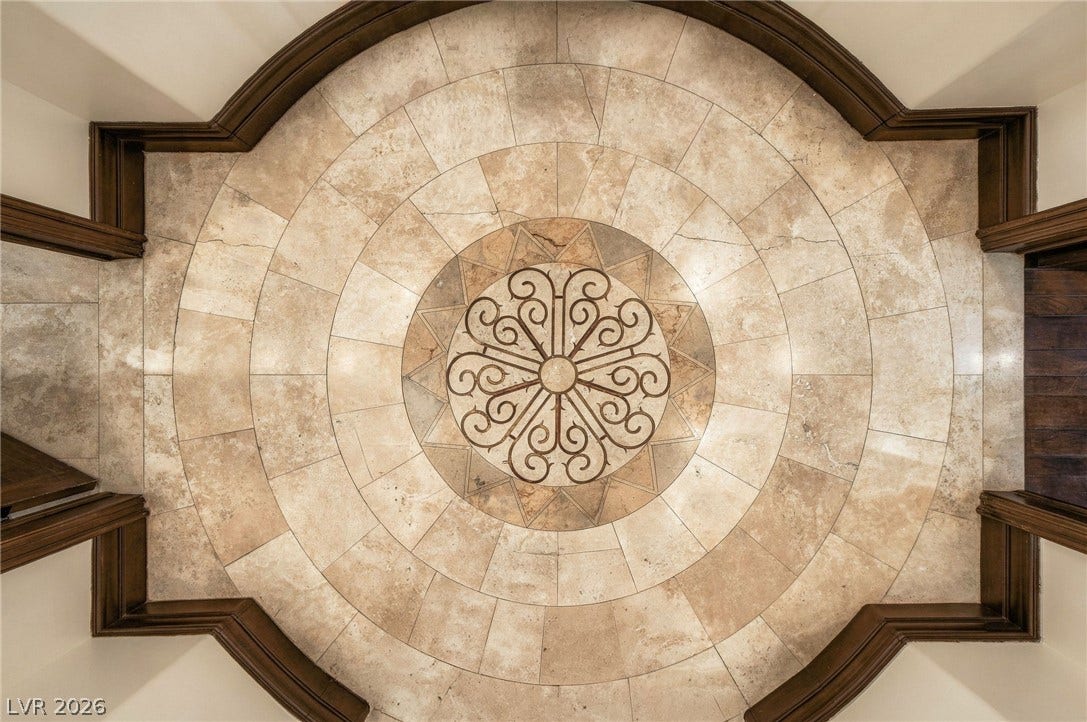 1513 Foothills Village Drive, Henderson, NV 89012 An intricate stone medallion highlights the custom tile flooring in this grand entryway.