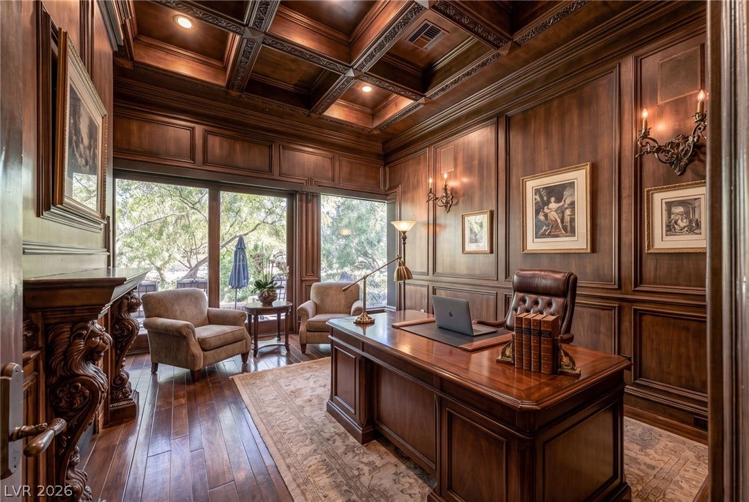 1513 Foothills Village Drive, Henderson, NV 89012 Rich wood paneling and a deeply coffered ceiling establish an elegant executive study.