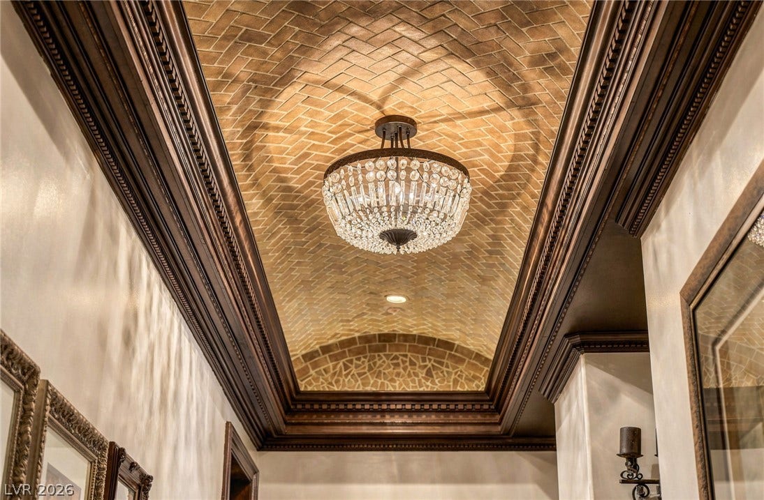 1513 Foothills Village Drive, Henderson, NV 89012 Ornate crown molding frames a herringbone brick barrel vault ceiling.