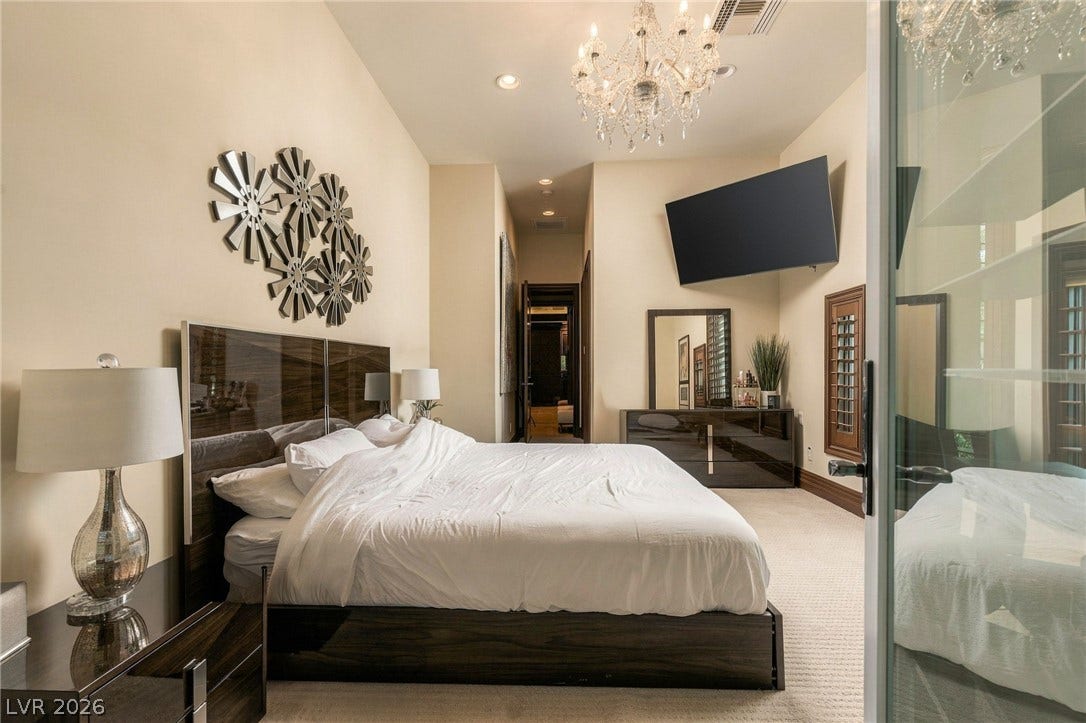 1513 Foothills Village Drive, Henderson, NV 89012 High ceilings and neutral tones create an inviting atmosphere in this main floor suite.