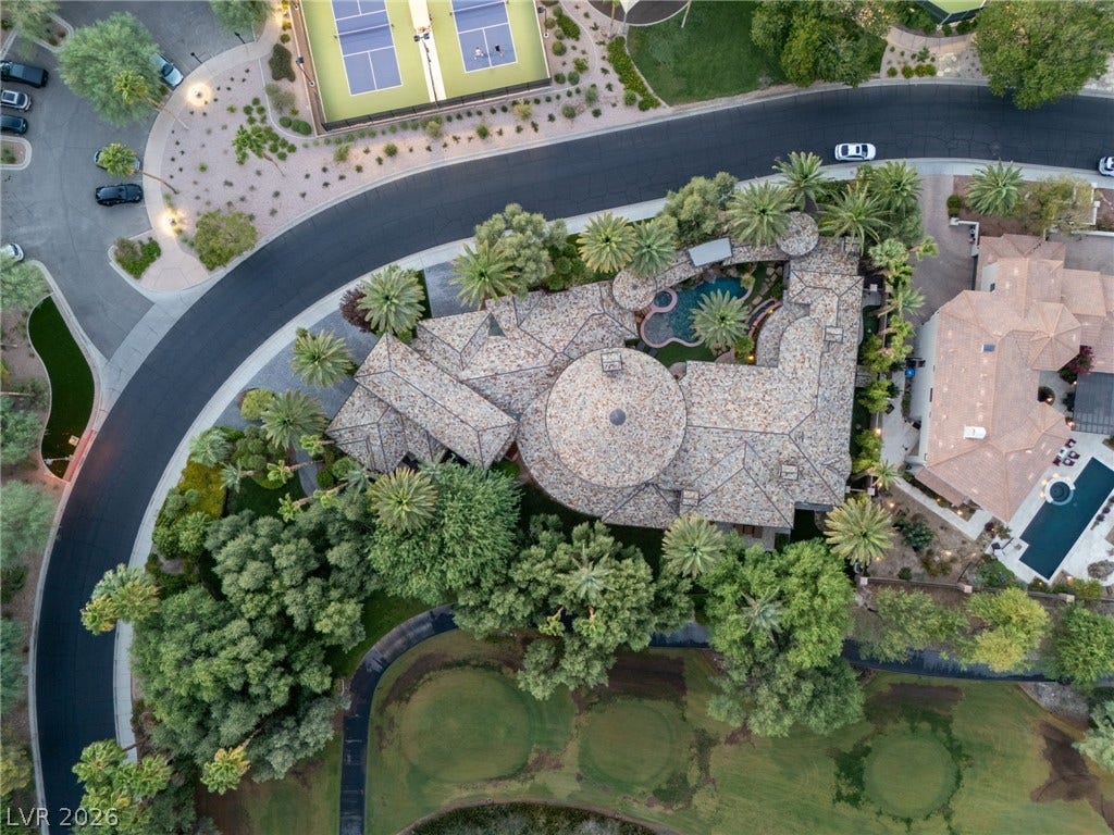 1513 Foothills Village Drive, Henderson, NV 89012 An aerial perspective captures the impressive tiled rooflines nestled along the golf course fairway.