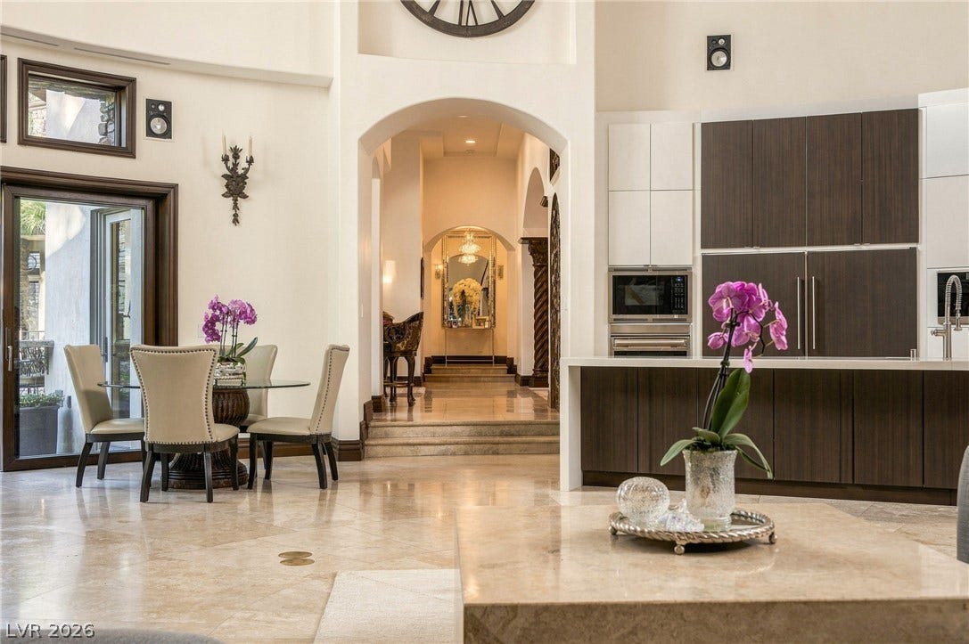 1513 Foothills Village Drive, Henderson, NV 89012 Polished tile flooring flows seamlessly through an open floorplan framed by soaring arched transitions.