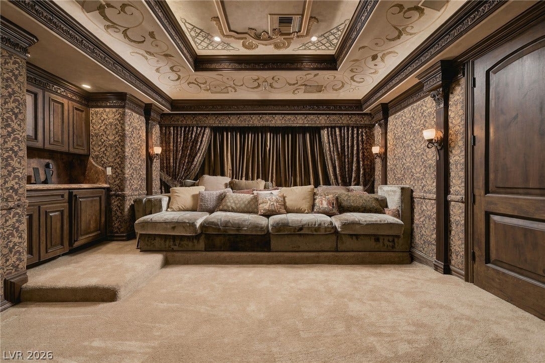 1513 Foothills Village Drive, Henderson, NV 89012 Ornate tray ceilings and classical millwork define this luxurious custom media room.