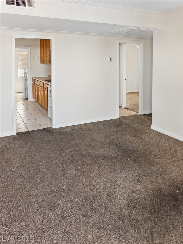 107 W Victory Road, Henderson, NV 89015 An open floor plan connects the main living space directly to the kitchen.